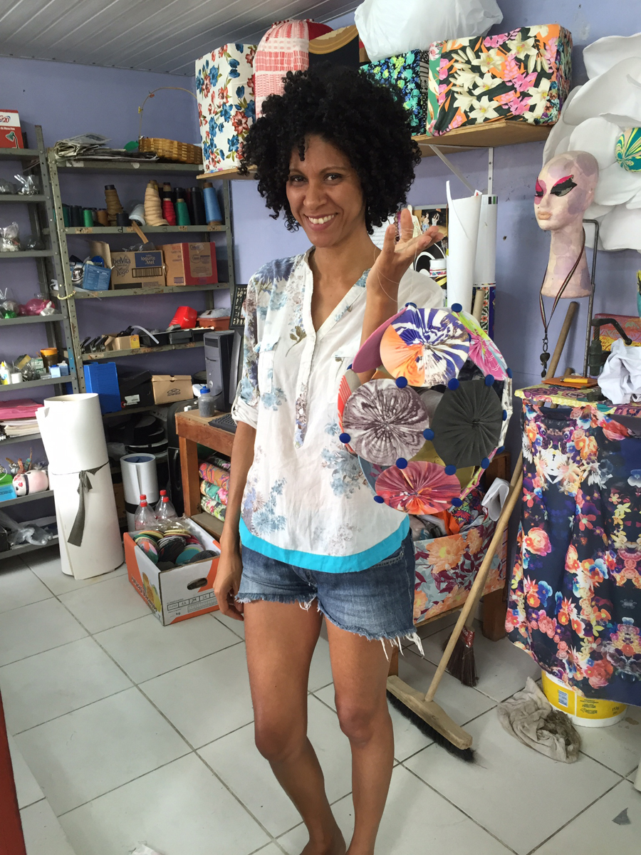Silvinha, the local woman who started RC, holding some of the art we make at the studio.
