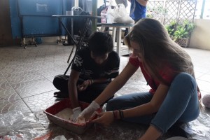 Chloe and Tim are the best of friends - here, they're mixing paper mache for an art workshop.
