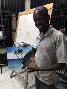 Jimson holding the painting he so patiently helped me with. Can you tell which palm tree is mine? Haha