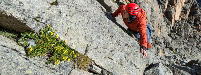 A man climbing a cliff