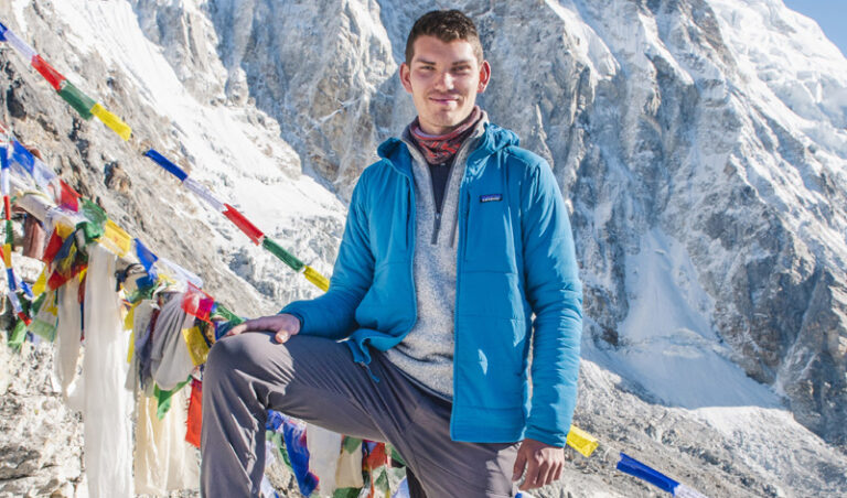 man standing with mountains in background