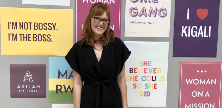 woman standing in front of signs