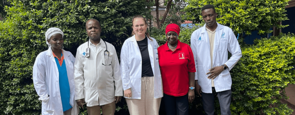 people standing in front of bushes