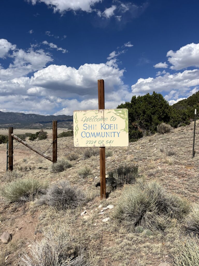 This image shows the welcome sign at Shii Koeii, up against a beautiful blue sky with rolling clouds! I am so grateful for my time here!